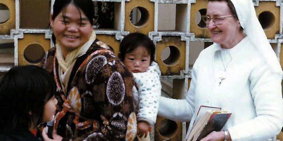 Sr. Damien with a mother and child at the Caritas Center in Fanling.