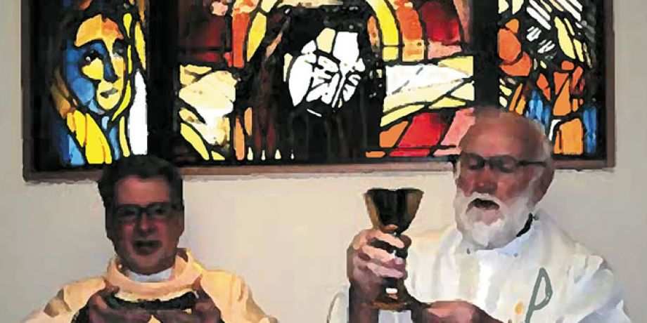 Columban Frs. Barry Cairns (right) and Leo Schumaker (left) in front of the window