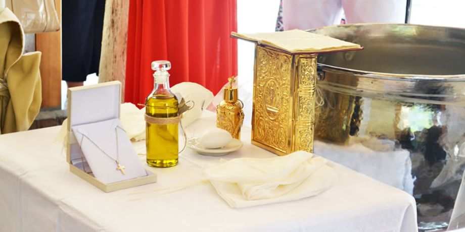 Table with holy chrism oil and other items for Catholic Confirmation
