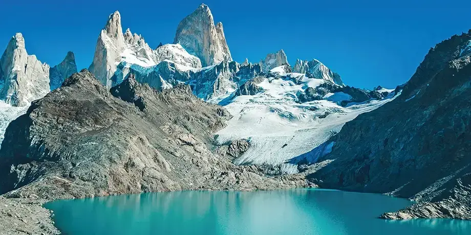 Scenic image of snowcapped mountains protecting a clear blue lake
