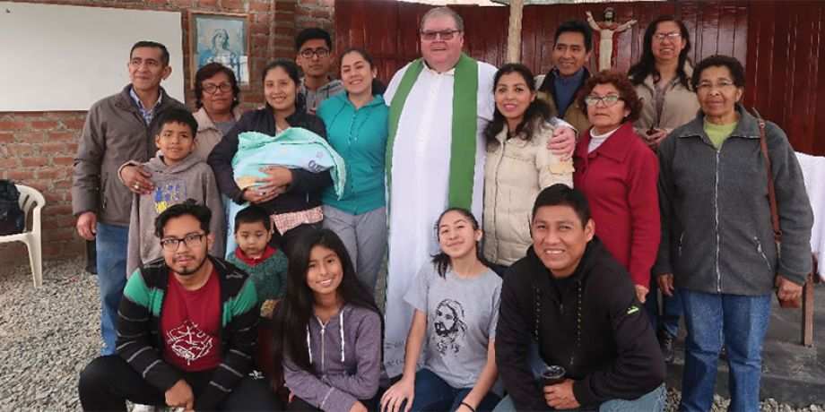 Fr. George Hogarty with the parishioners of the Sacred Heart of Jesus.