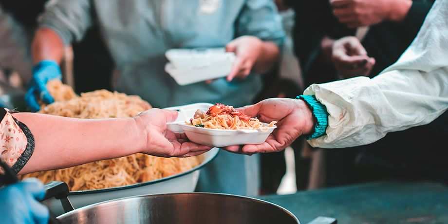 Volunteers serve food