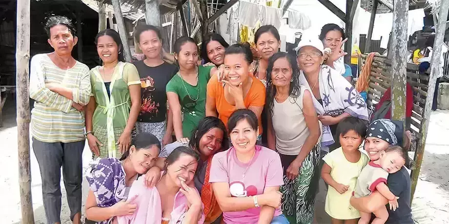 Ana Flores (front row, center) with women and children in Narulang community.