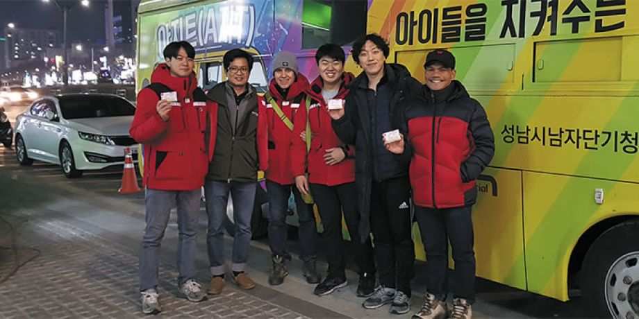 Fr. Vincenzo and his team with the bus