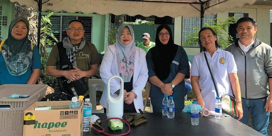 Fr. Ramon Torres (second from left) with Muslim women doctors and Alito (far right)