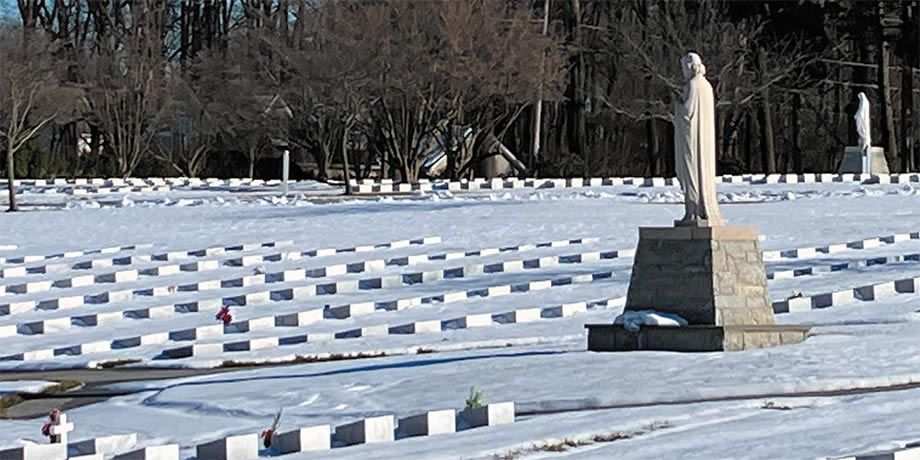 Snow blankets a cemetery 
