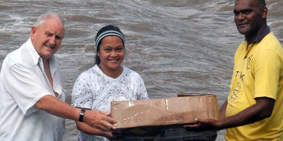 Carrying the altar cloth after the trip across the river
