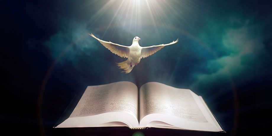 Dove over an open bible surrounded by clouds