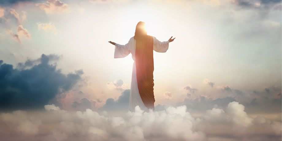 Resurrected Jesus Christ ascending above the sky and clouds