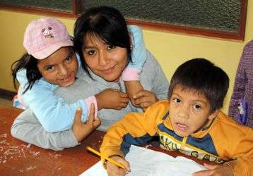 A volunteer works with children and the center