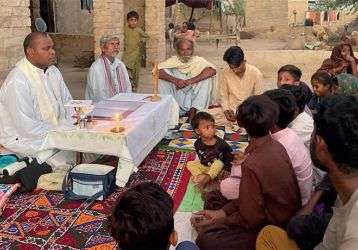 Fr. Iowane Naio celebrates Mass with the Sindhi Bheels community in Pangrio Village.