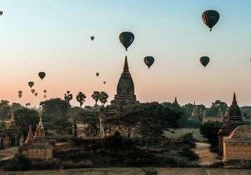 Hot air balloons fly over an ancient city in Myanmar