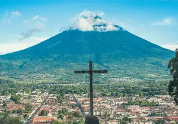 A cross overlooking the city of Livingston, Guatemala