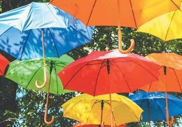 Colorful umbrellas float in the air