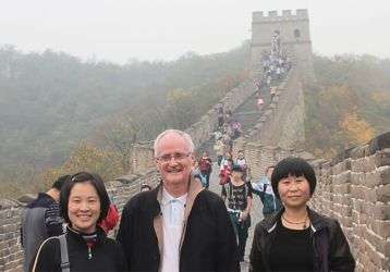 Fr. Alo Connaughton with students at the Great Wall of China